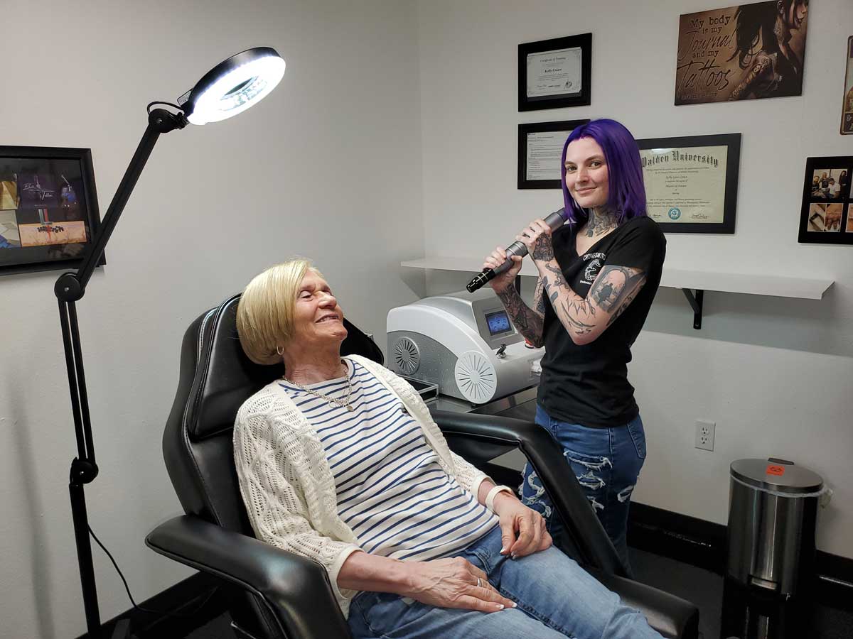 Explaining to client how carbon facial laser treatment works.
